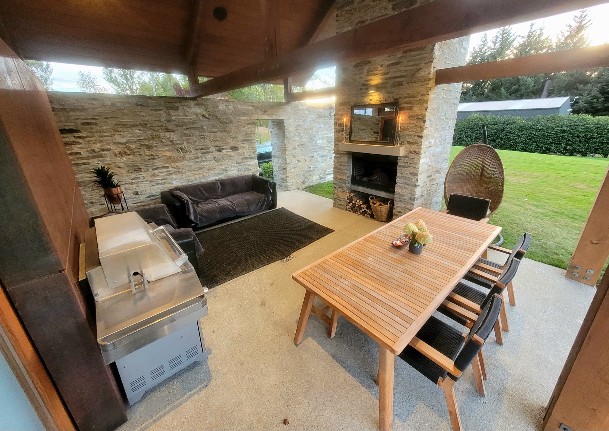 The courtyard barbecue and seating under the timber roof