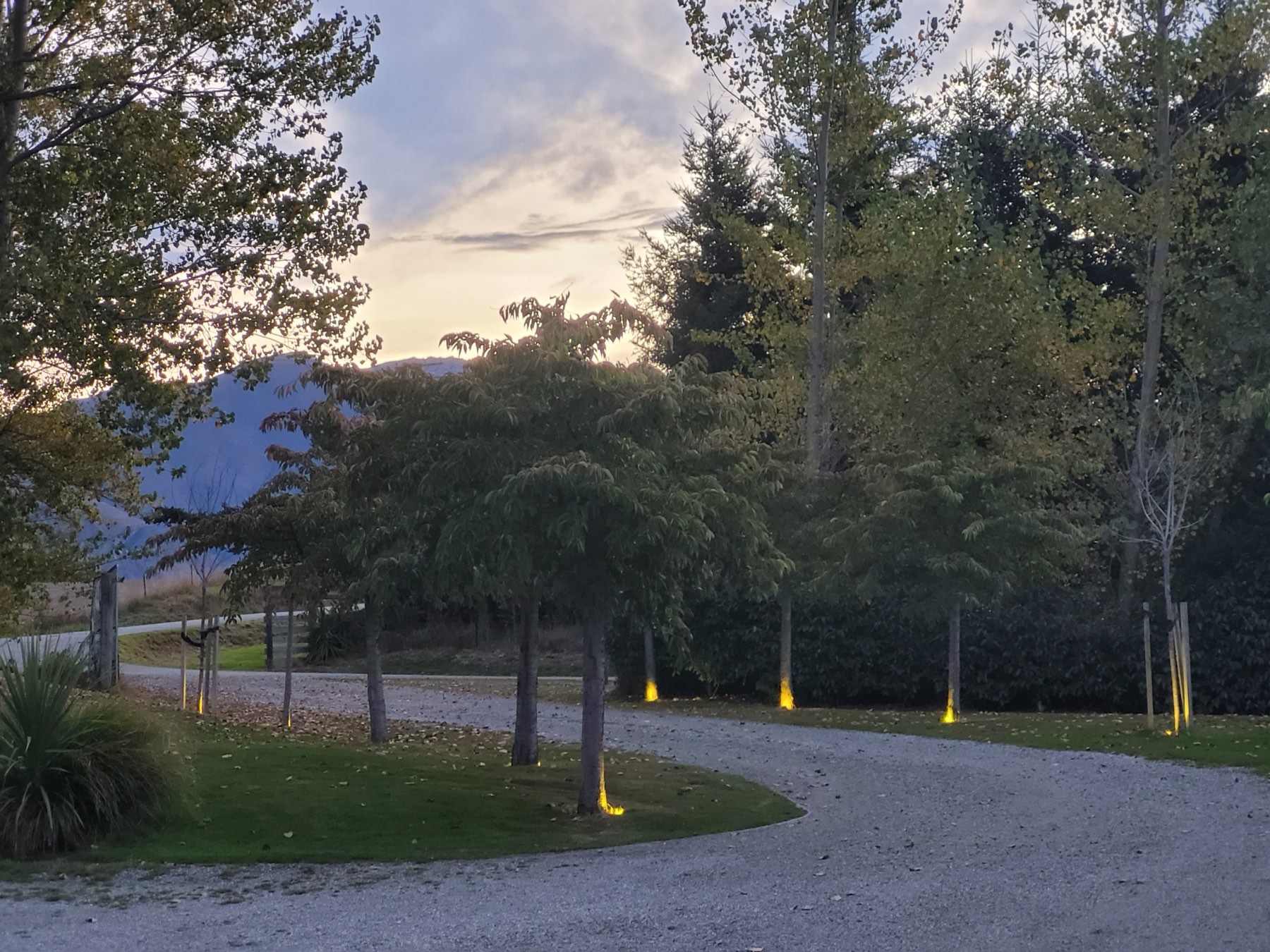 The driveway at dusk, path lights on