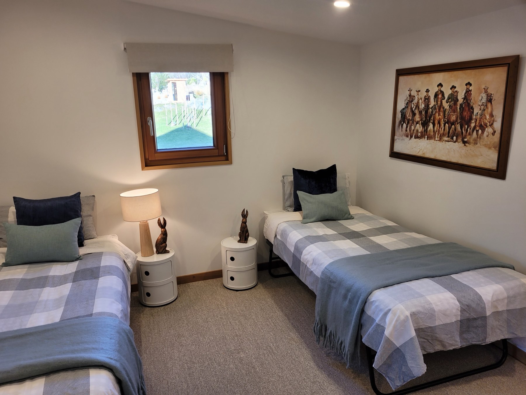 A guest bedroom made up as two singles — the same beds join to make a super king