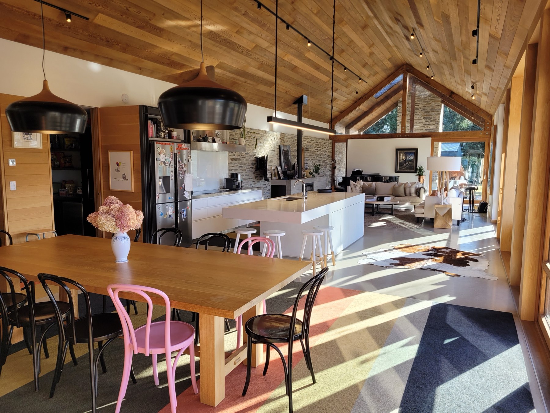 The dining table, with the kitchen and living room beyond