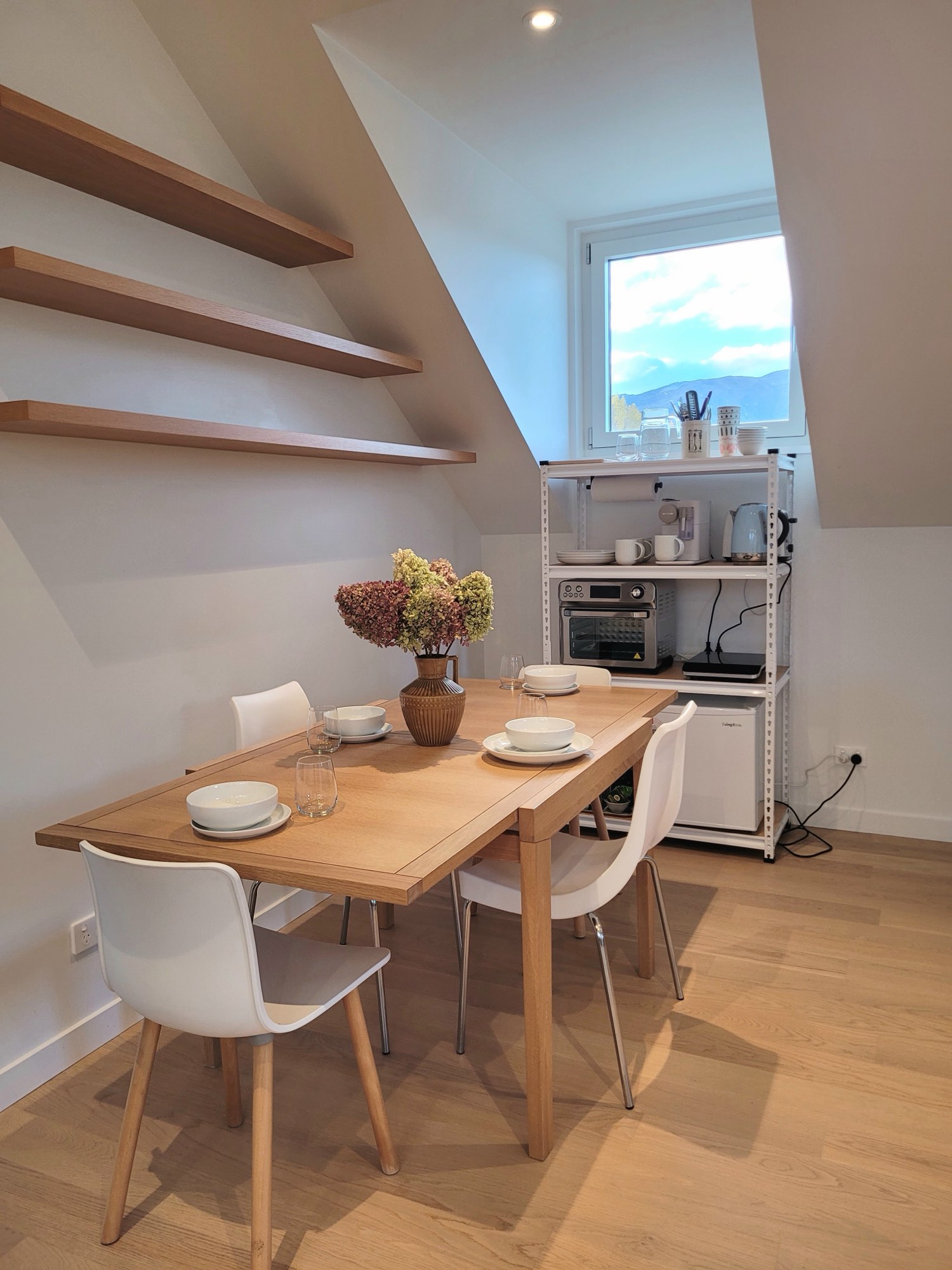 The dining table and kitchenette under the pitch