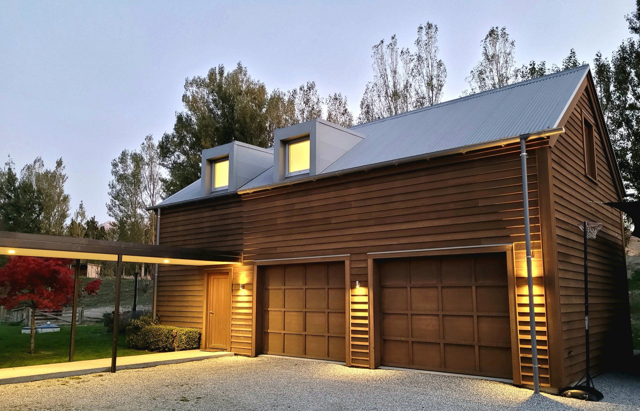 The Loft and its garages at dusk