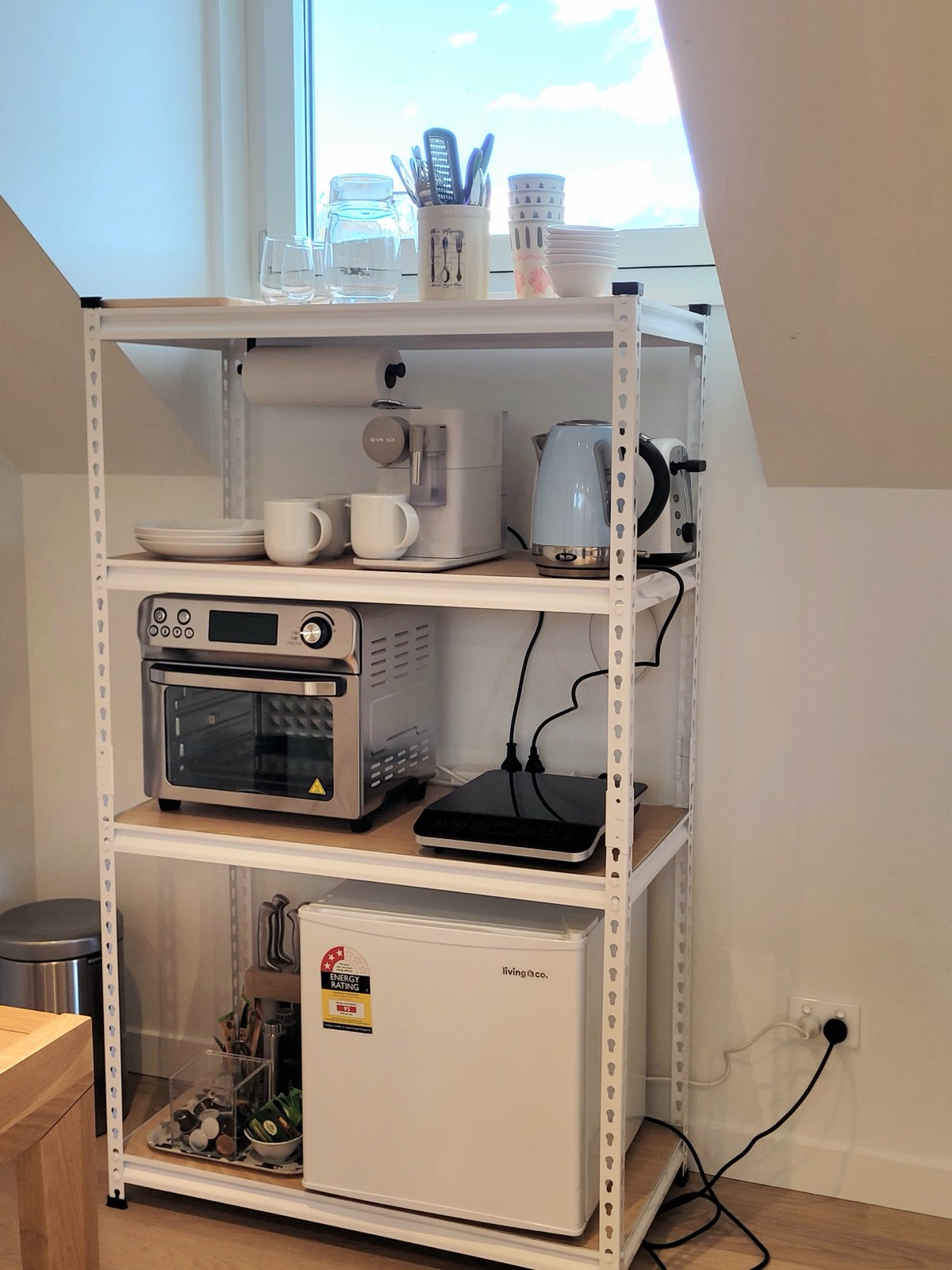 The kitchenette — oven, hob, kettle and fridge