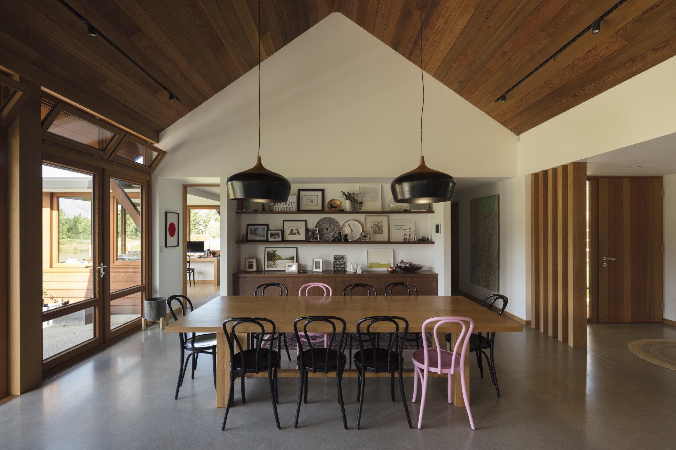 The dining table under the pitch, and the picture shelf behind it