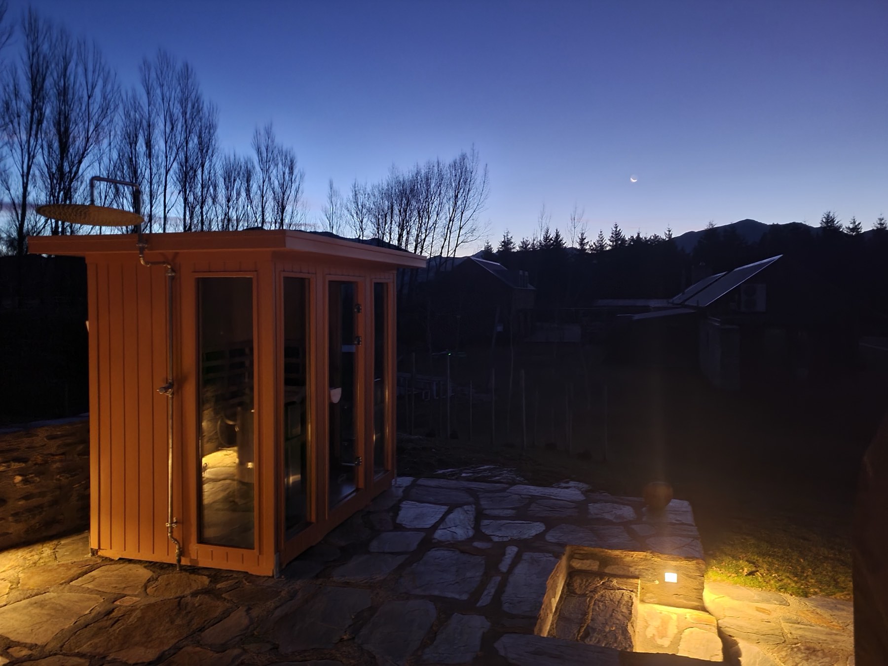 The sauna glowing on the terrace