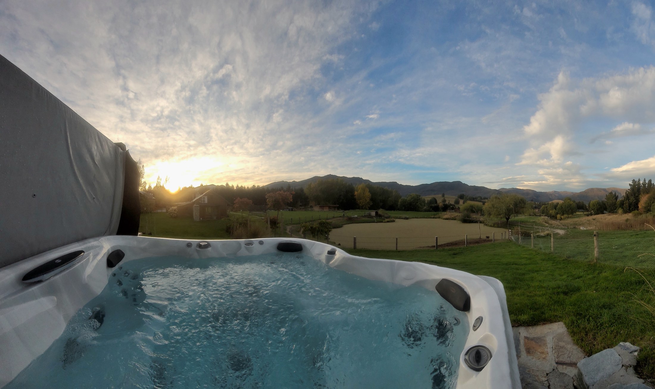 The spa looking west over the pond at sunset